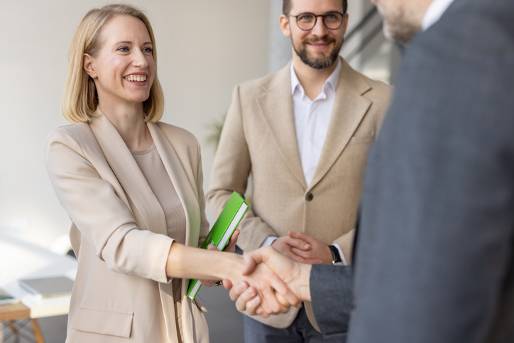 A close-up of a business handshake represents a symbol of connection and partnership among professionals, emphasizing trust and collaboration.