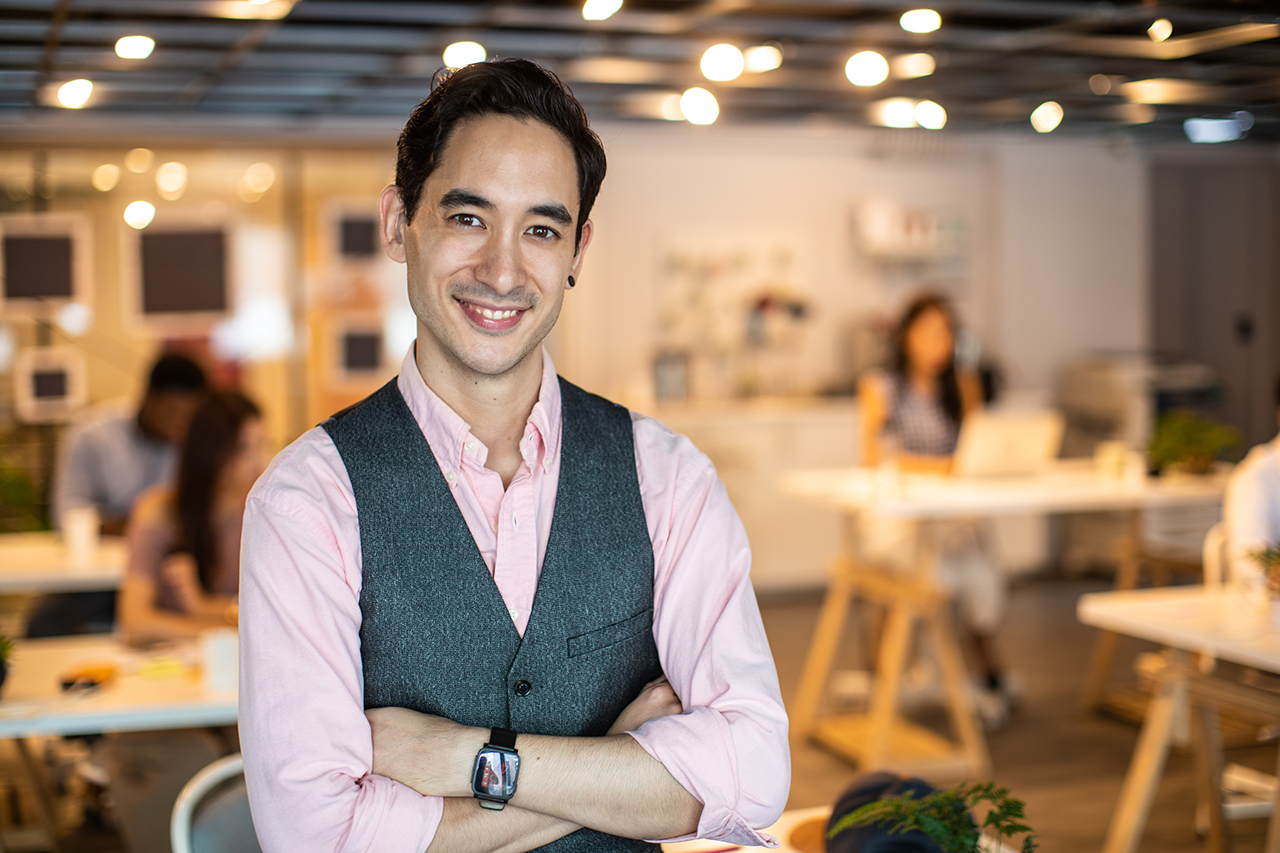 Portrait of successful , Hearing impaired businessman ,young  man  looking at camera and smiling